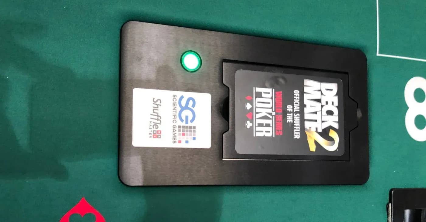 deck mate 2 cards shuffler on green felt table