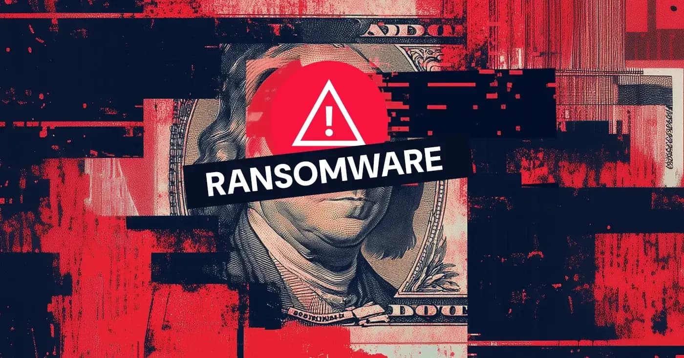 100-dollar bill with exclamation icon and ransomware label over Ben Franklin's face