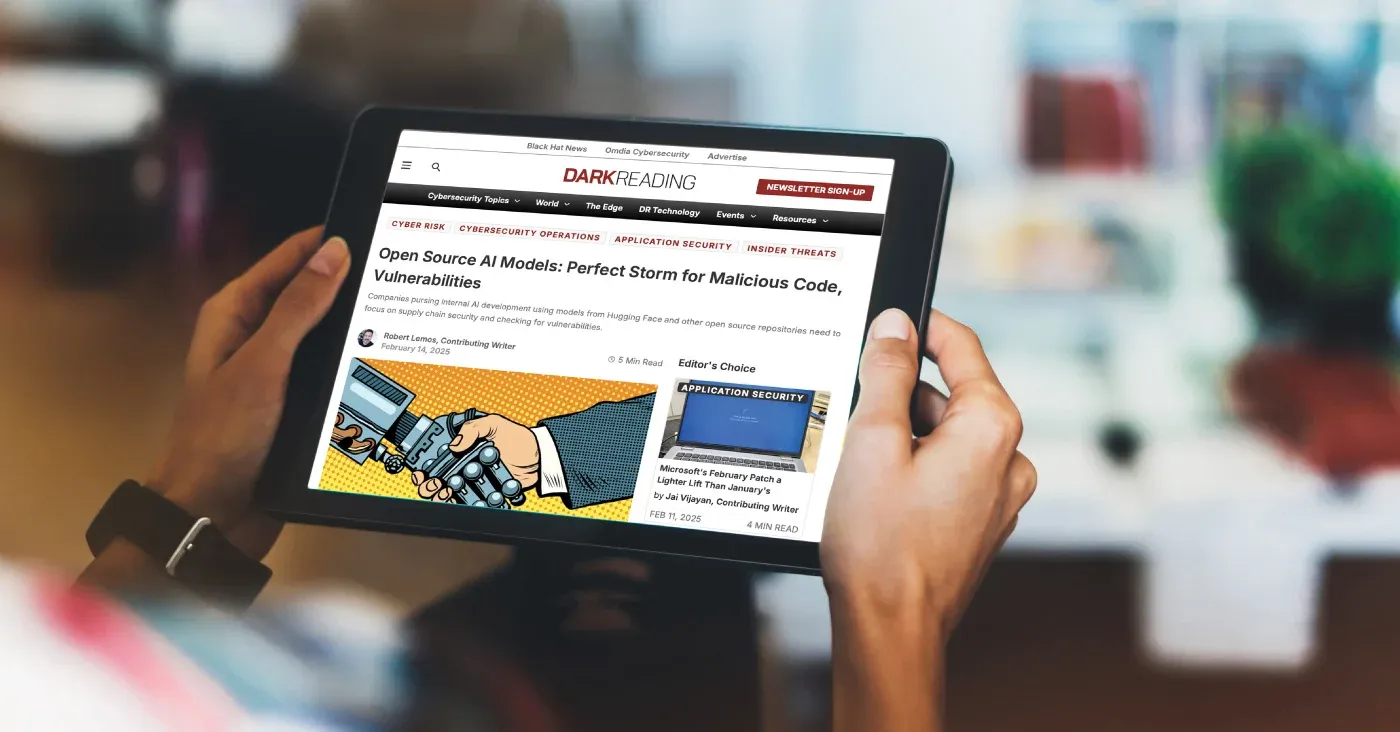 tablet being held displaying news article