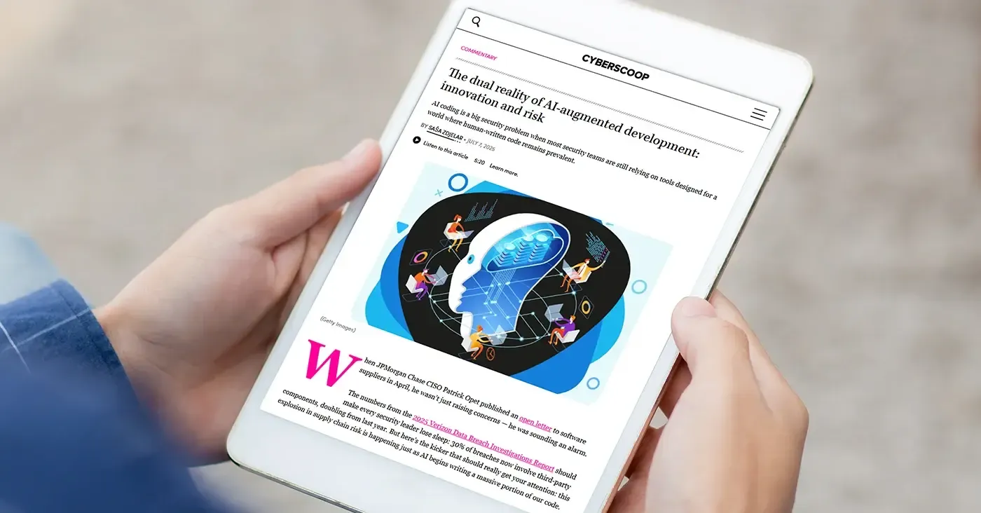 tablet being held displaying news article