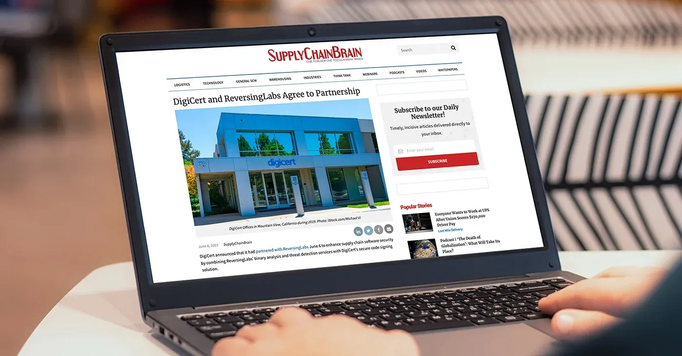 laptop open to news article