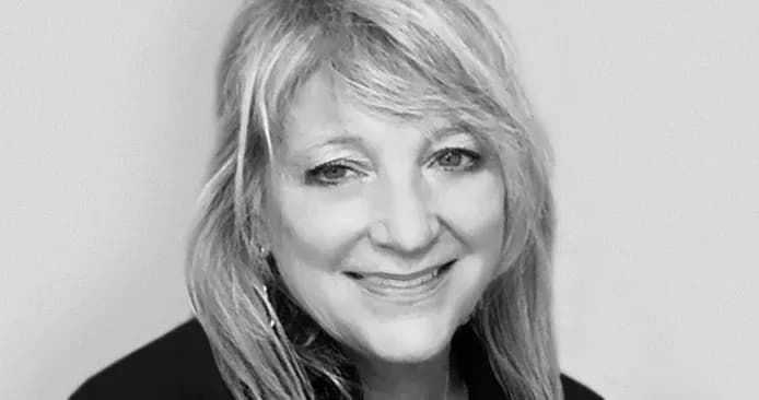 Kathleen DeShields headshot in black and grey