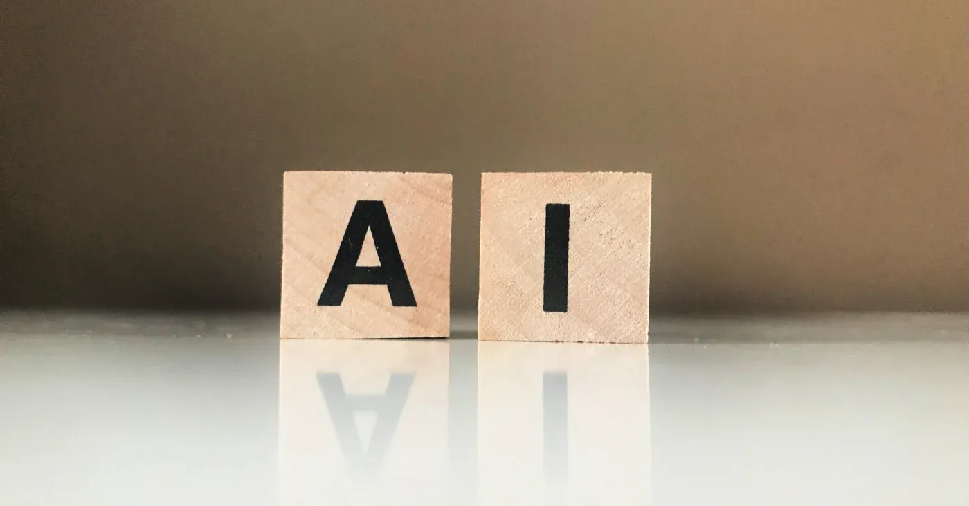 scrabble letters spelling AI