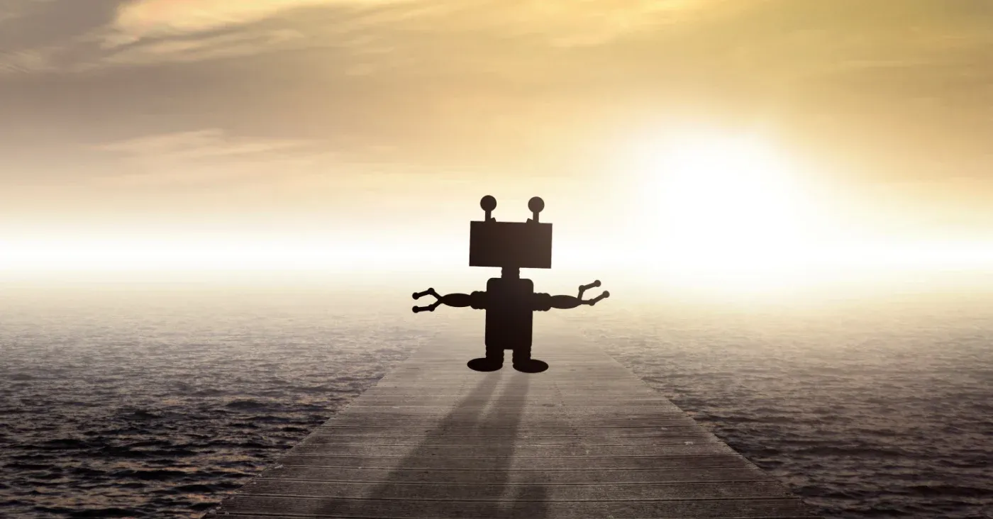 robot silhouette facing sunset ocean horizon on dock