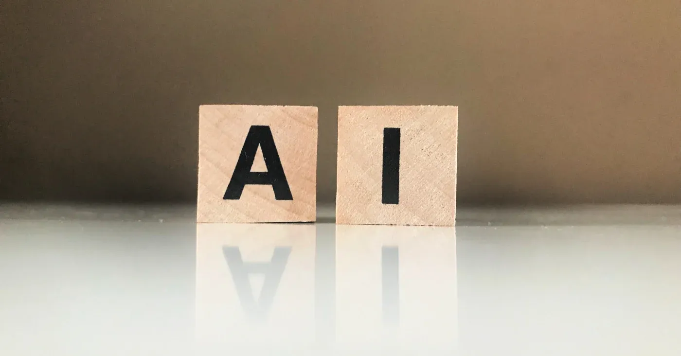 scrabble letters spelling AI