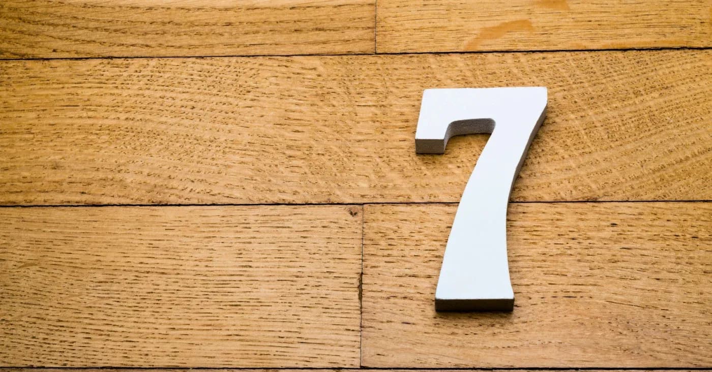 number 7 sitting on wood floor