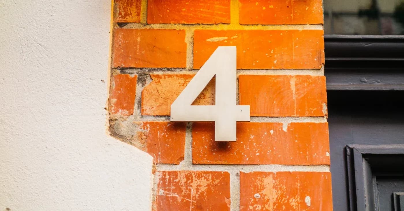 number 4 on brick wall