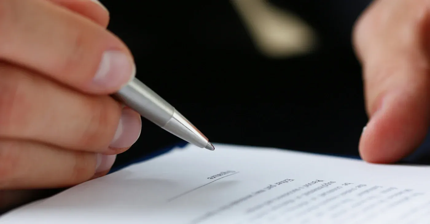 pen in hand annotating book