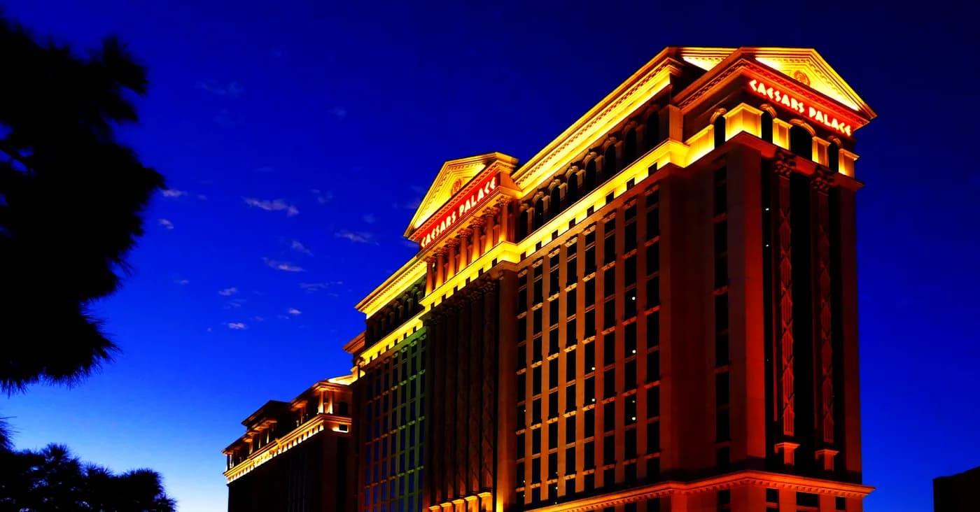 caesars palace hotel lit up at night