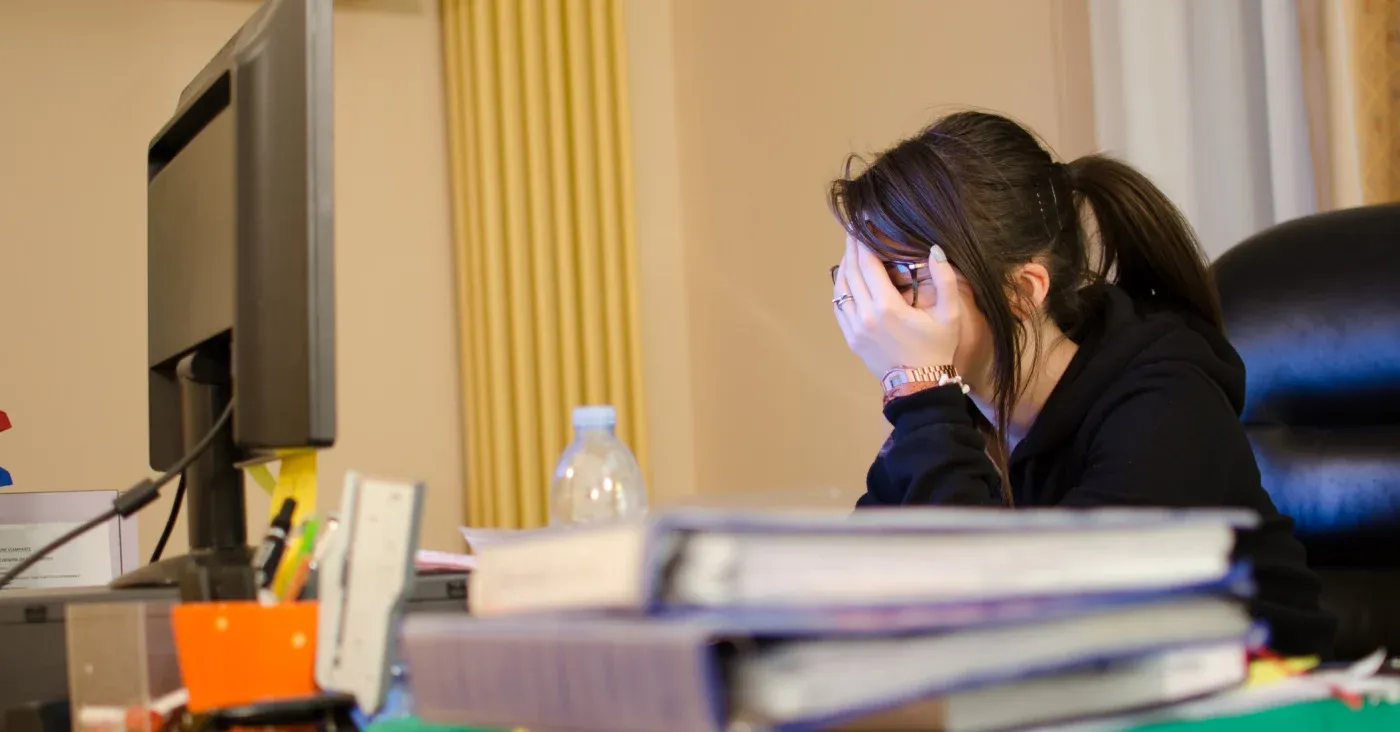 distressed woman at computer