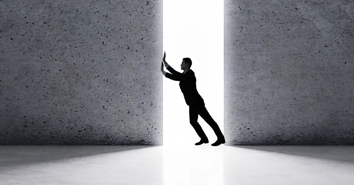 man holding concrete walls open