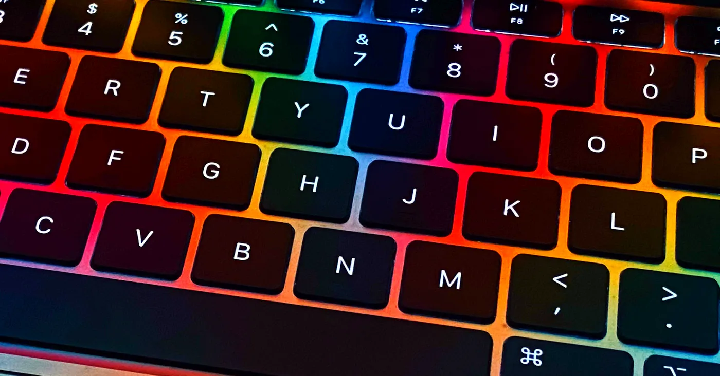 computer keyboard with rainbow background