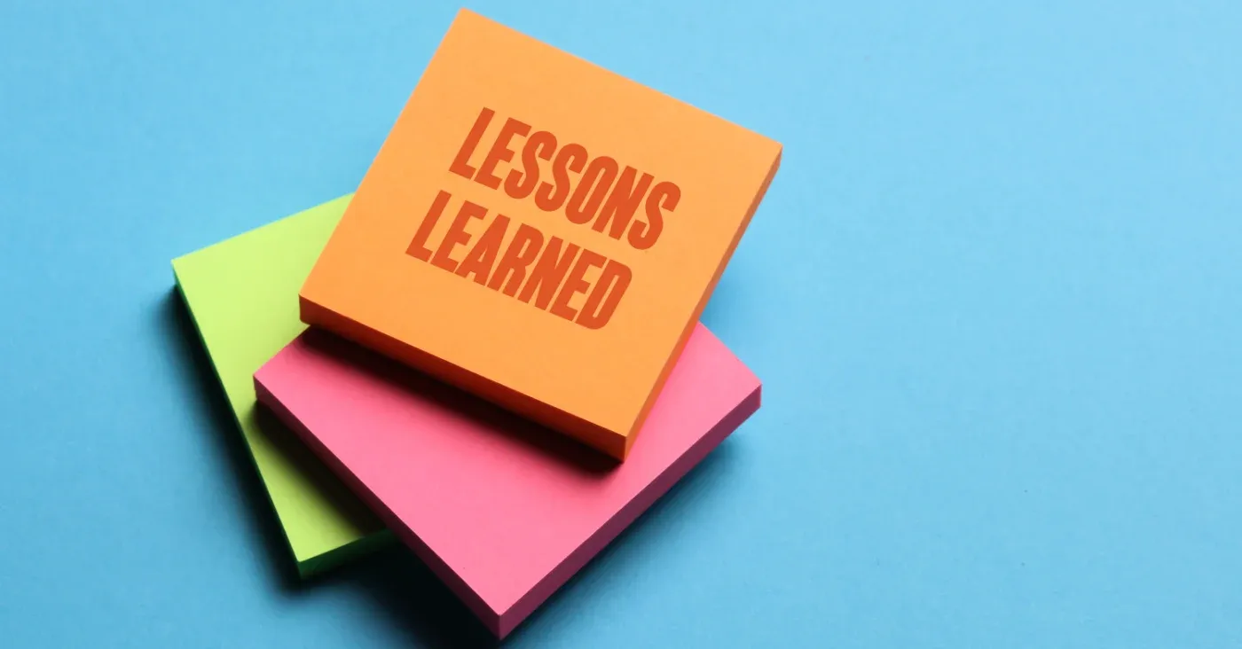 sticky notes with Lessons Learned written on top