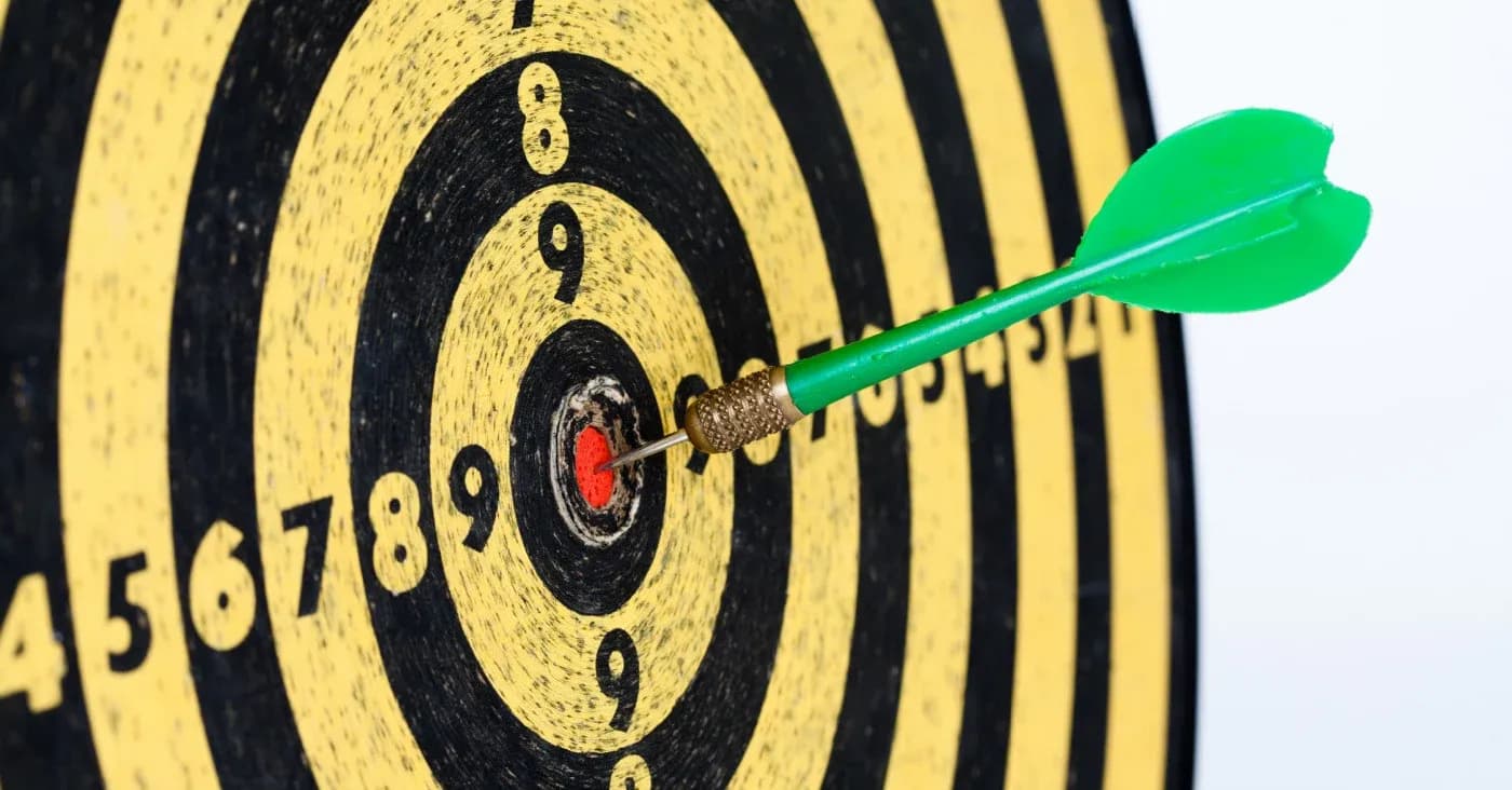 dart board with dart on bullseye