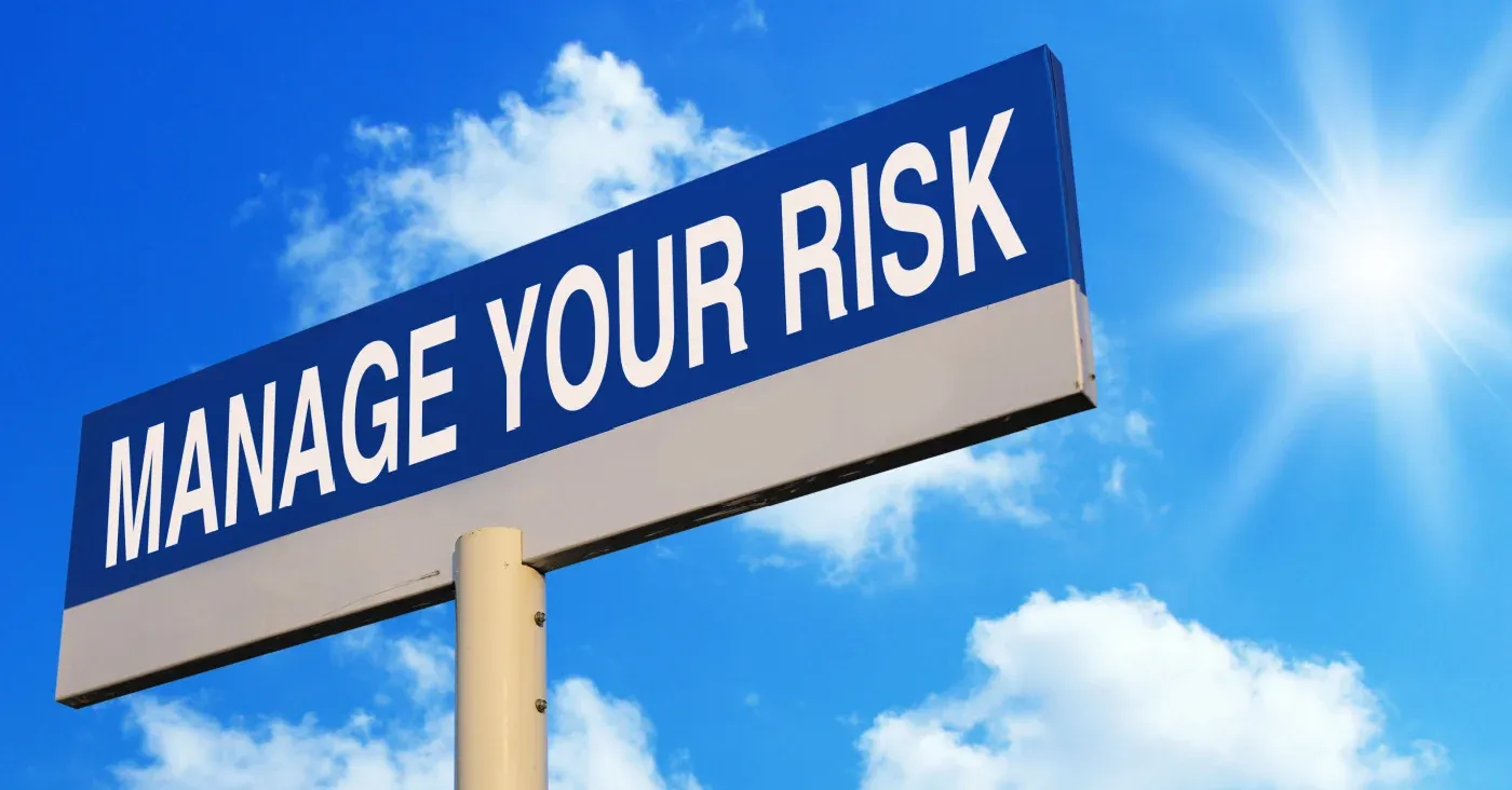big sign that says manage your risk