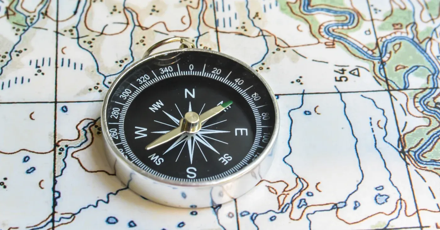 map and compass stock photo