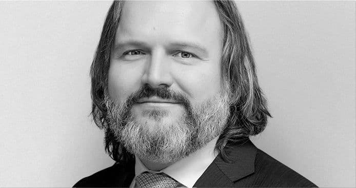 Mario Vuksan headshot in black and grey