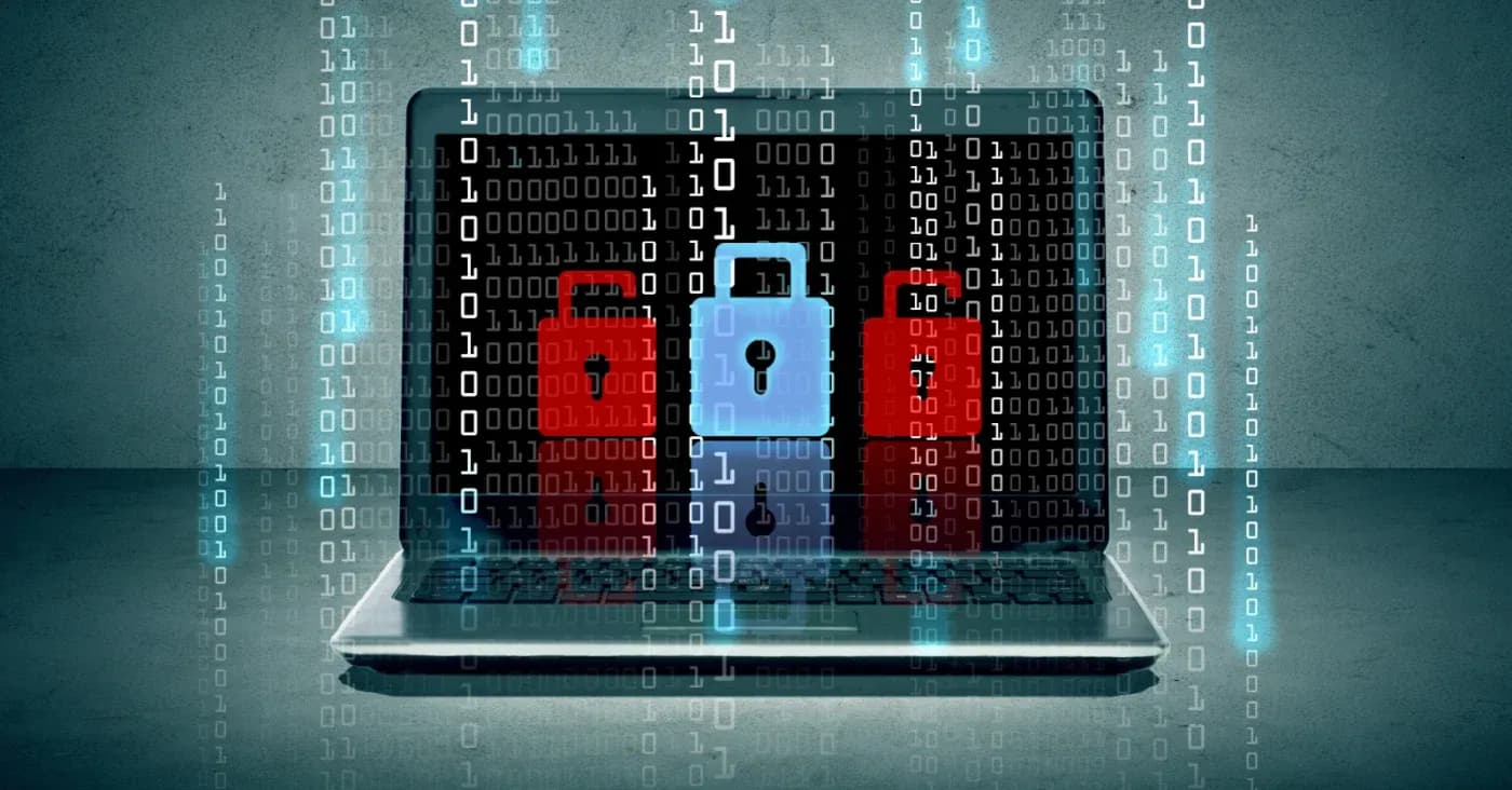 three locks in front of binary code streaming down over open laptop