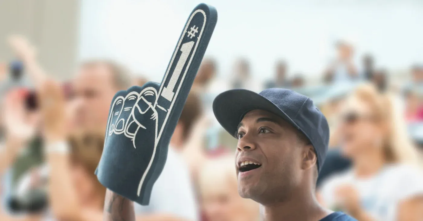 sports fan holding up number one foam finger