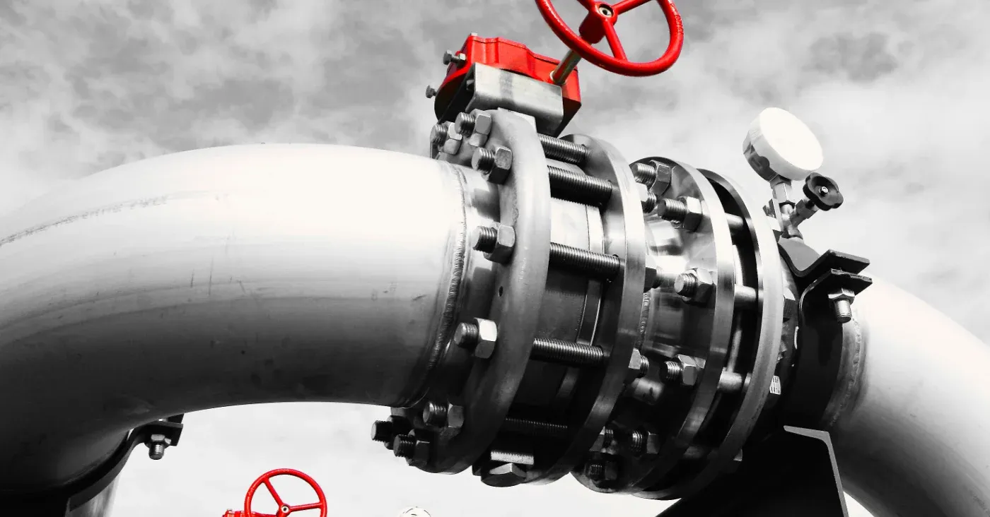 big pipeline with red shutoff valve