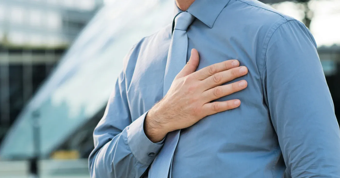 man with hand on chest pledging