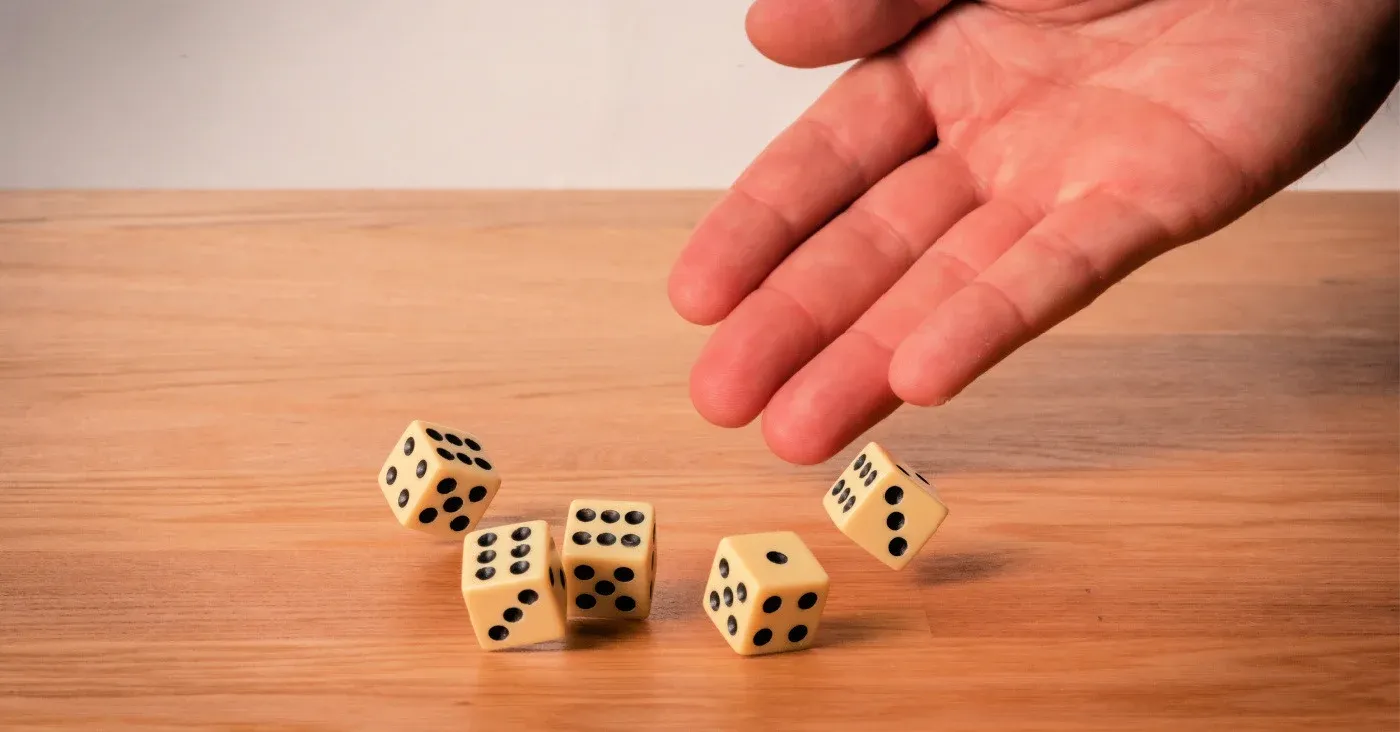 person rolling five dice
