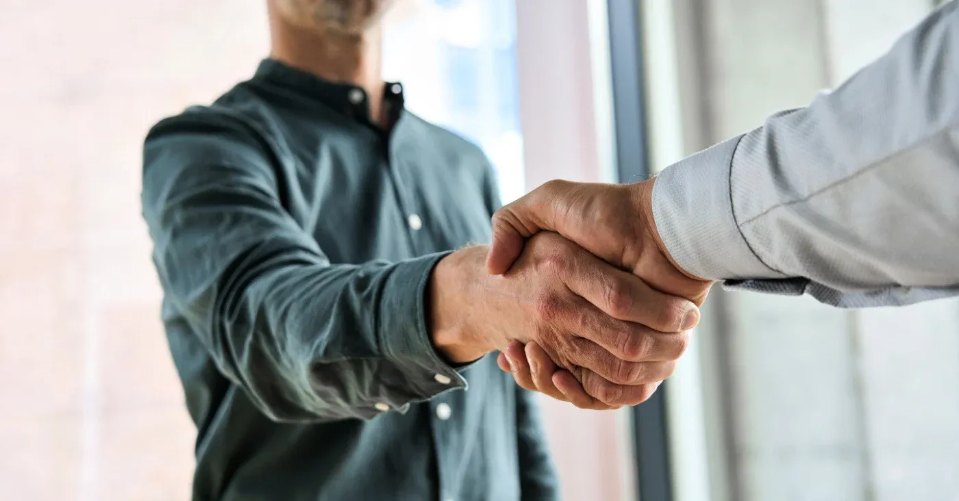 two men shaking hands