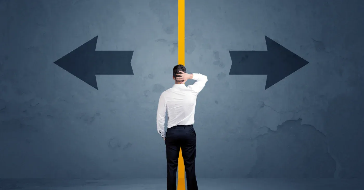 man facing dilemma left and right arrows