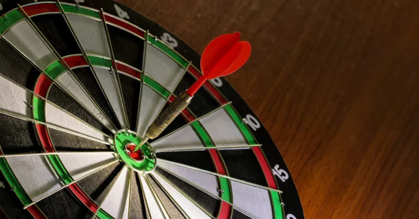 dart board with dart on bullseye