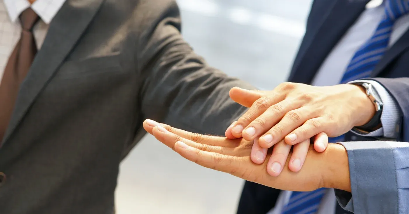 hands joined in partnership