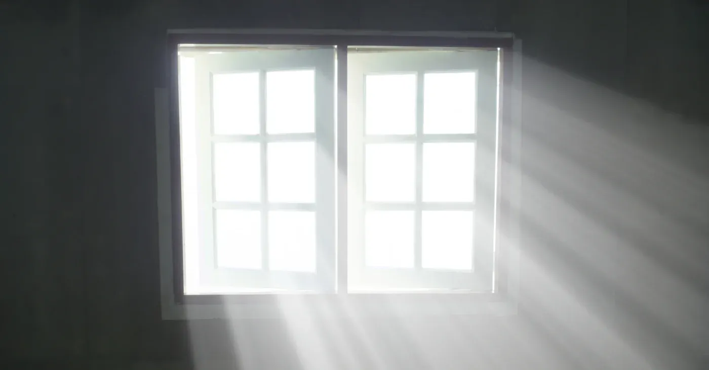 sun coming in through windows into dusty air