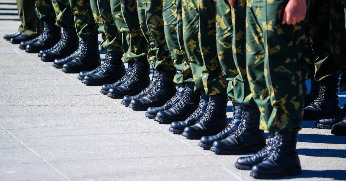 line of soldiers in uniform from the knees down